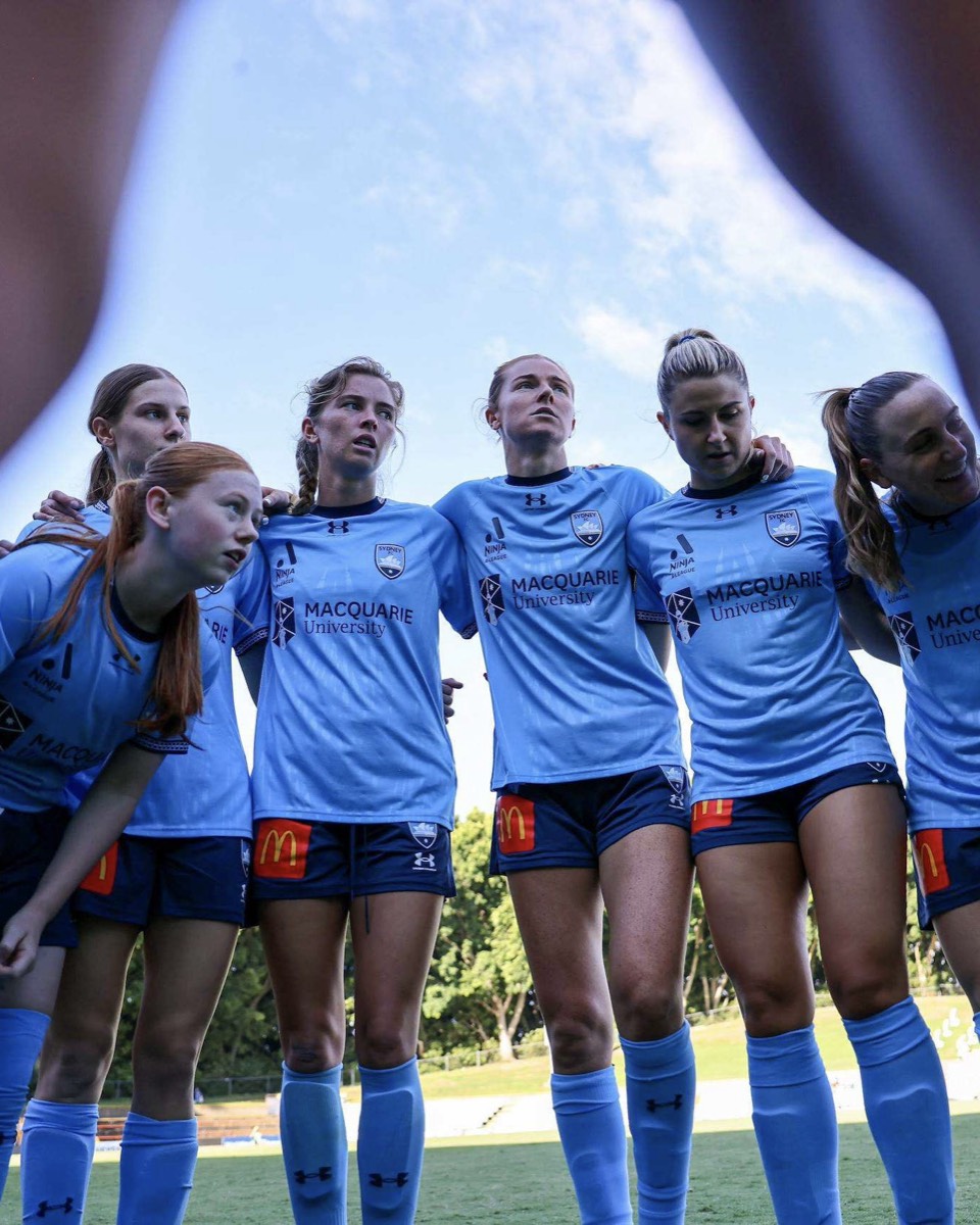Sydney FC Women players in a team huddle before a match